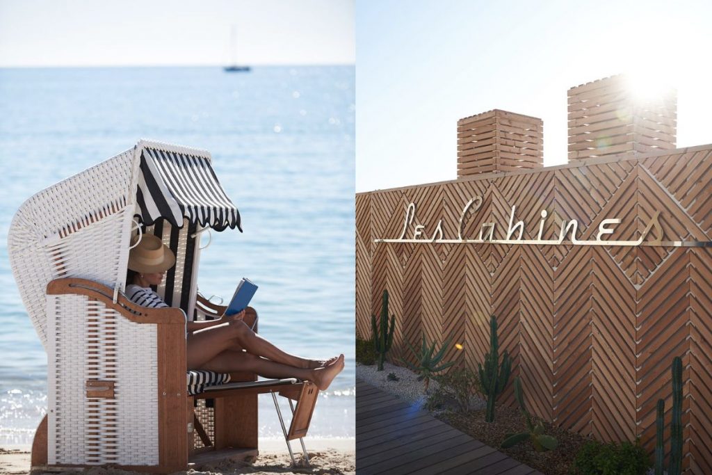 Terrasse au style vintage chic avec parasols rayés pastel du restaurant Les Cabines à Juan-les-Pins